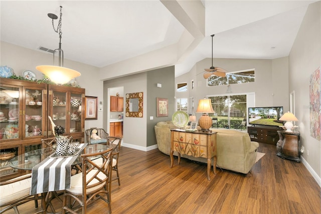 dining space with vaulted ceiling, hardwood / wood-style floors, and ceiling fan