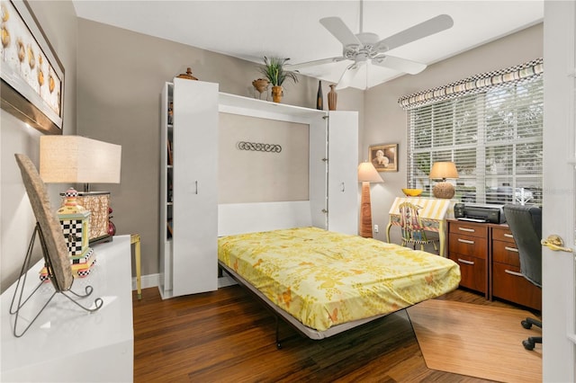 bedroom with ceiling fan and dark hardwood / wood-style floors