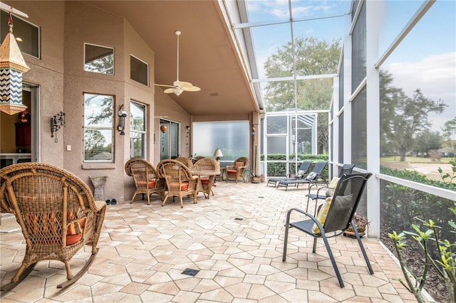 sunroom / solarium with ceiling fan