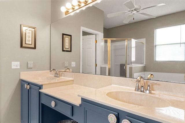 bathroom with vanity, ceiling fan, and a shower with shower door