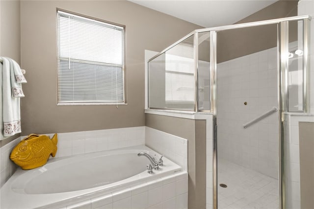 bathroom featuring plus walk in shower