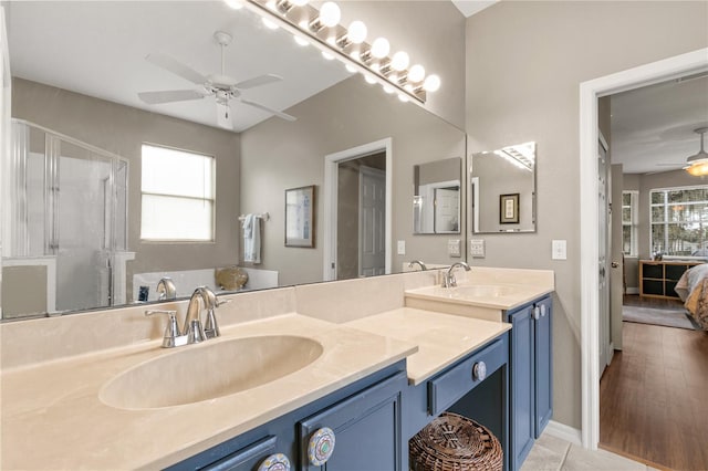 bathroom with vanity, tile patterned floors, ceiling fan, and walk in shower