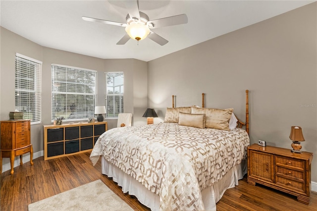 bedroom featuring ceiling fan and dark wood-type flooring