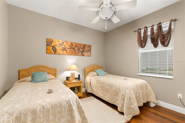 bedroom featuring hardwood / wood-style floors and ceiling fan