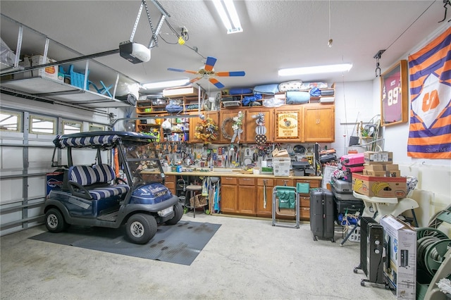 garage featuring a workshop area and a garage door opener