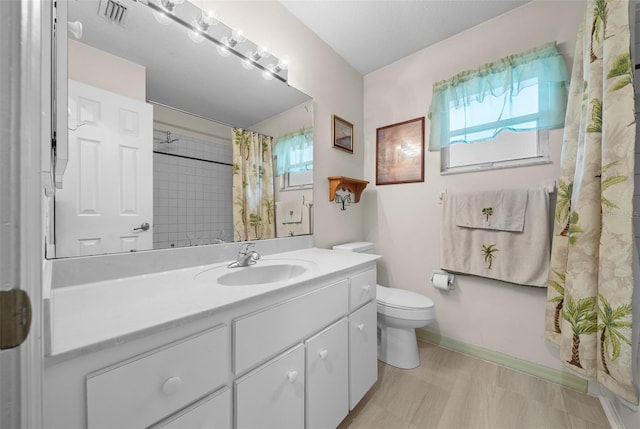 full bathroom featuring toilet, vanity, visible vents, and a shower with curtain