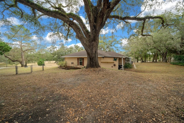 view of yard featuring a gate and fence