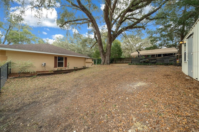 view of yard featuring fence