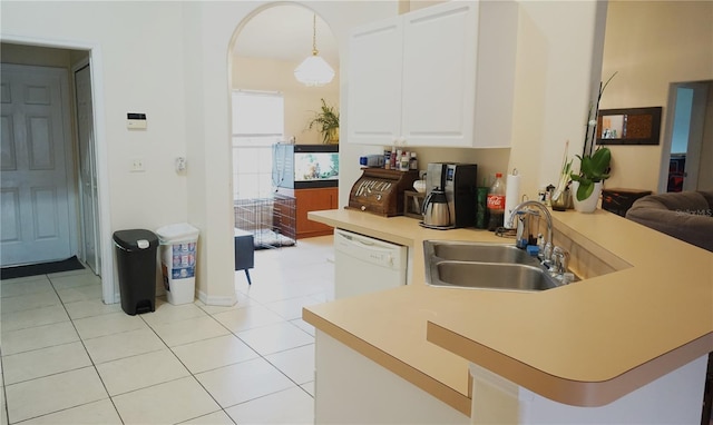 kitchen with pendant lighting, sink, dishwasher, white cabinets, and kitchen peninsula