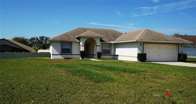 single story home featuring a garage and a front yard