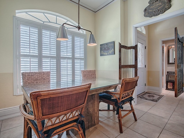 dining space featuring light tile patterned floors