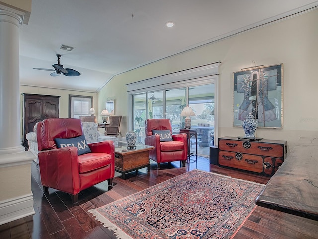 living room with ceiling fan, vaulted ceiling, dark hardwood / wood-style flooring, and decorative columns