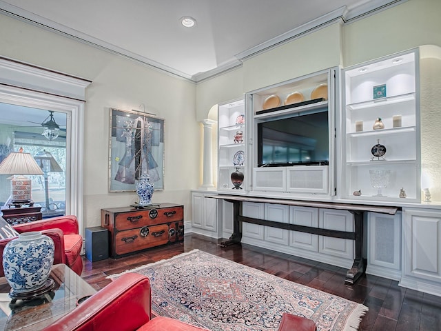 living room with ceiling fan, dark wood-type flooring, and crown molding