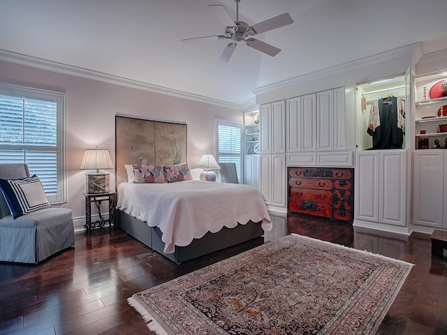 bedroom with vaulted ceiling, ceiling fan, ornamental molding, and dark hardwood / wood-style floors