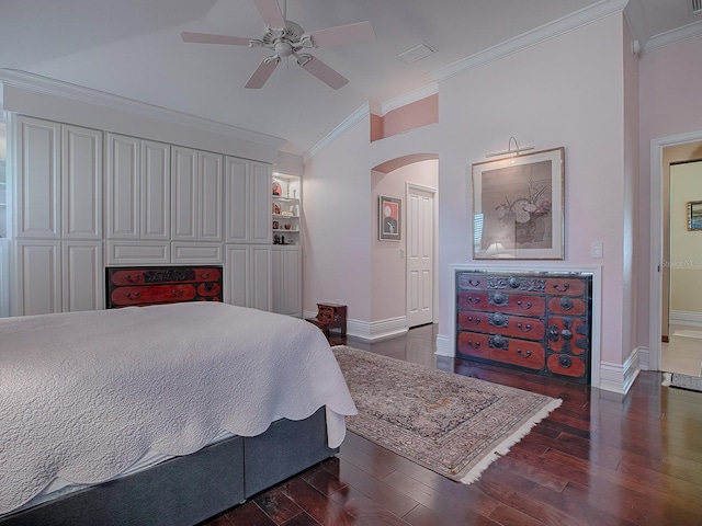 bedroom with ceiling fan, a closet, dark wood-type flooring, and crown molding