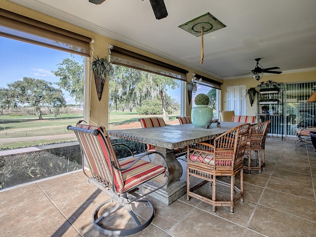 sunroom with ceiling fan