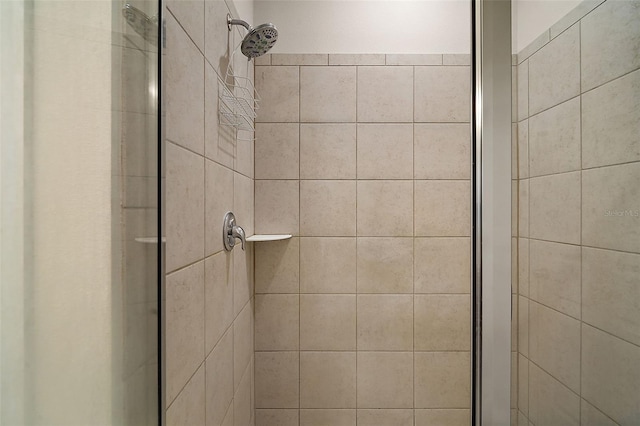 bathroom with a tile shower