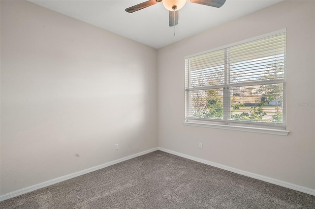 carpeted empty room featuring ceiling fan