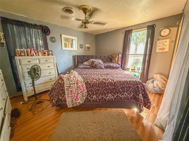 bedroom featuring ceiling fan and hardwood / wood-style floors