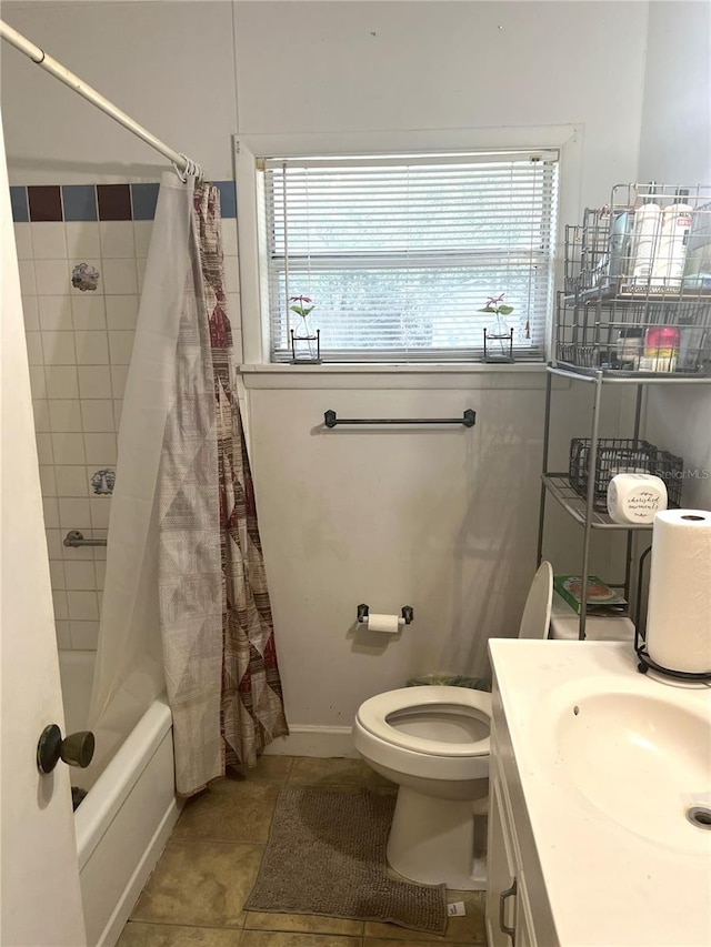 full bathroom featuring shower / bathtub combination with curtain, tile patterned floors, plenty of natural light, and toilet