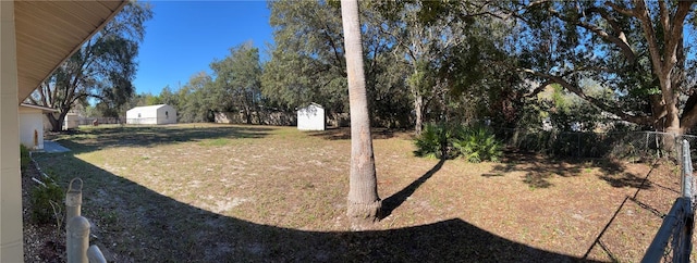 view of yard with a storage unit