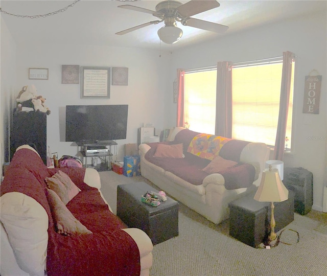 living room featuring carpet and ceiling fan