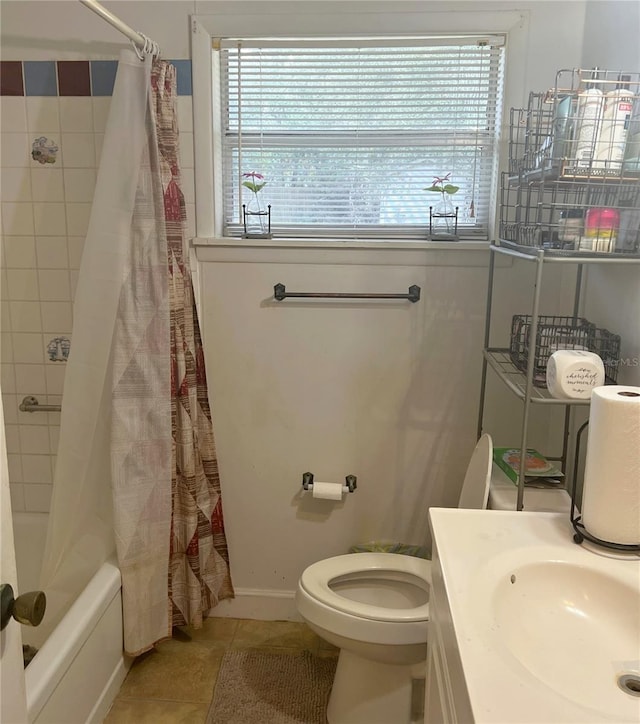 full bathroom with tile patterned floors, toilet, shower / bath combo with shower curtain, and a wealth of natural light