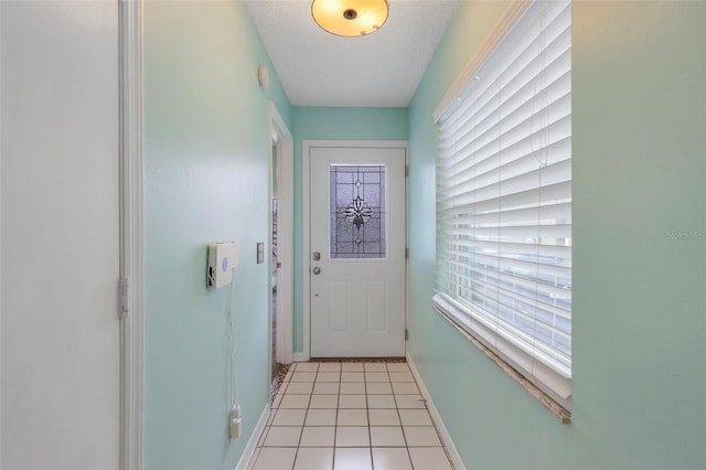 doorway featuring light tile patterned flooring