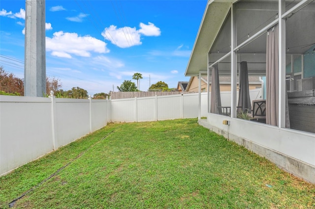 view of yard with a sunroom