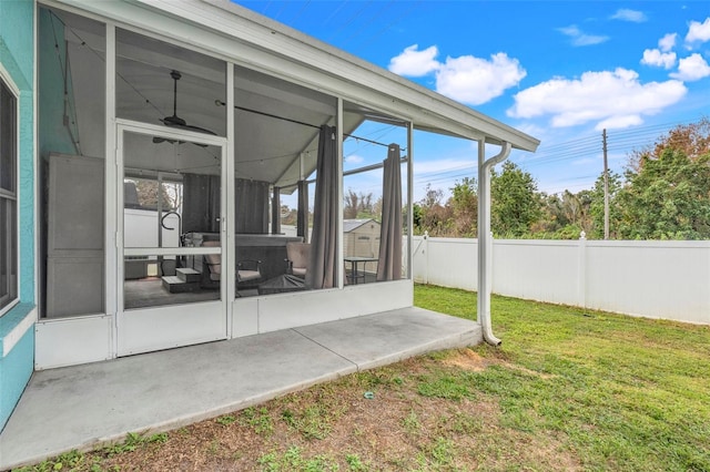 view of patio featuring a sunroom