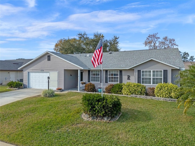 ranch-style home with a front yard and a garage