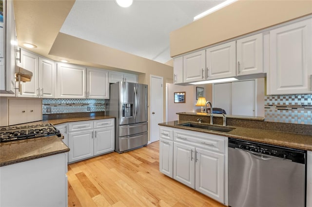 kitchen with white cabinets, appliances with stainless steel finishes, and sink