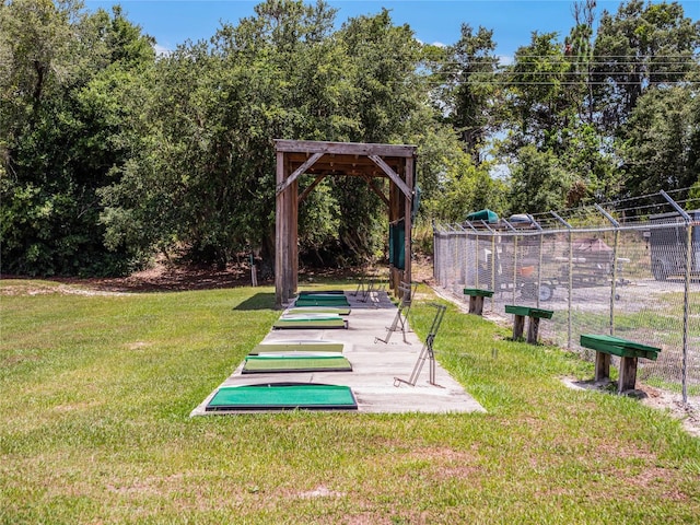 view of community featuring a yard