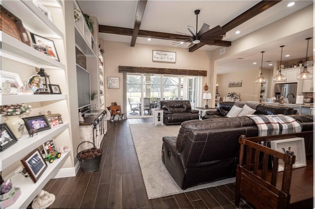 living room featuring ceiling fan and beamed ceiling