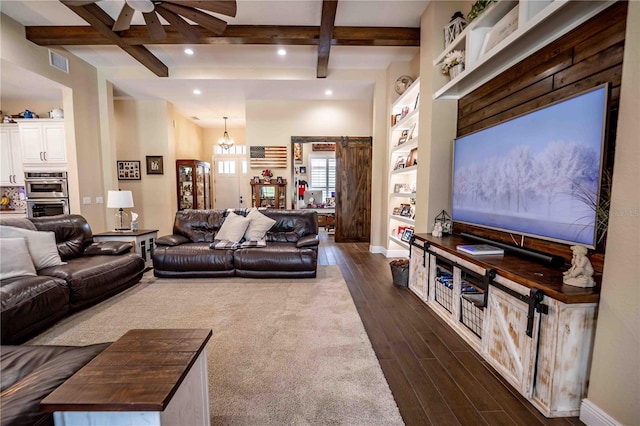 living room with ceiling fan with notable chandelier, dark wood-type flooring, coffered ceiling, and beamed ceiling