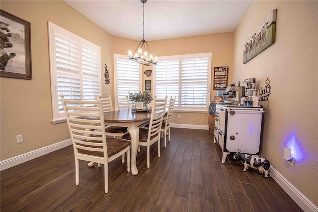 dining space with dark wood-type flooring and an inviting chandelier