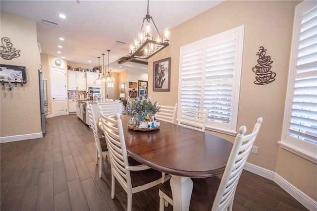 dining area featuring dark hardwood / wood-style flooring