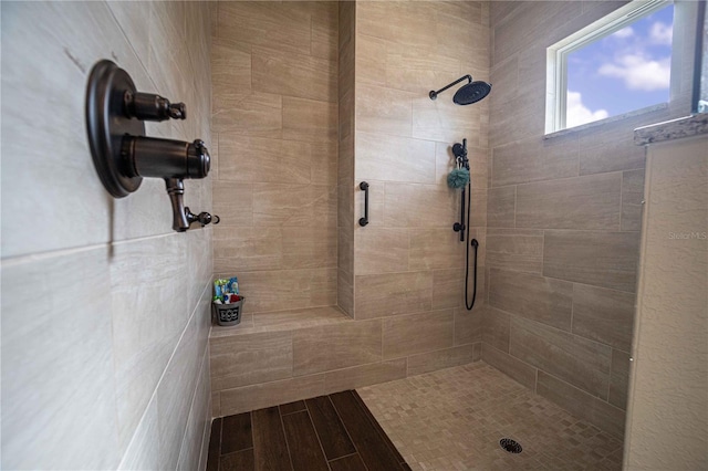 bathroom featuring a tile shower