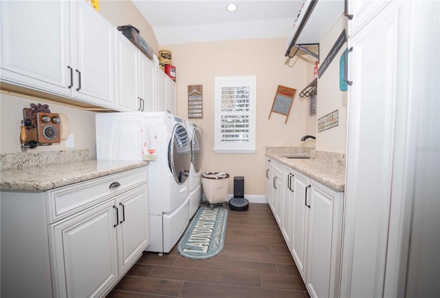 laundry room featuring sink, cabinets, and independent washer and dryer