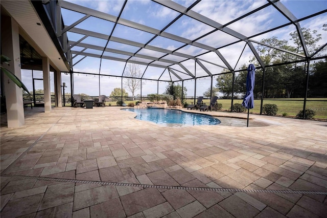 view of pool with a lanai and a patio