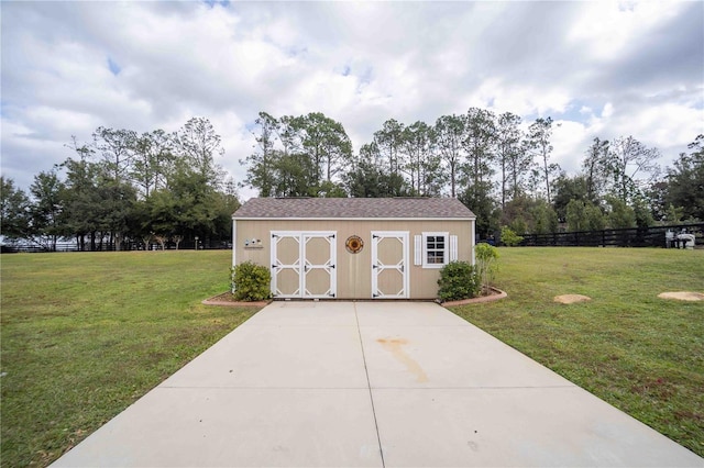 view of outdoor structure with a lawn