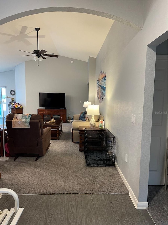 living room featuring ceiling fan, vaulted ceiling, and hardwood / wood-style floors