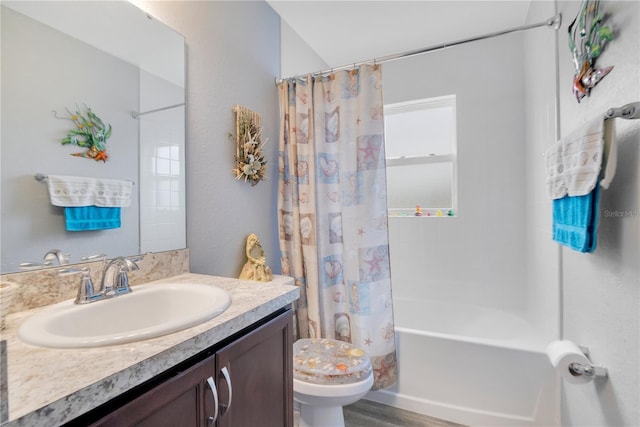 full bathroom featuring toilet, vanity, and shower / bath combination with curtain