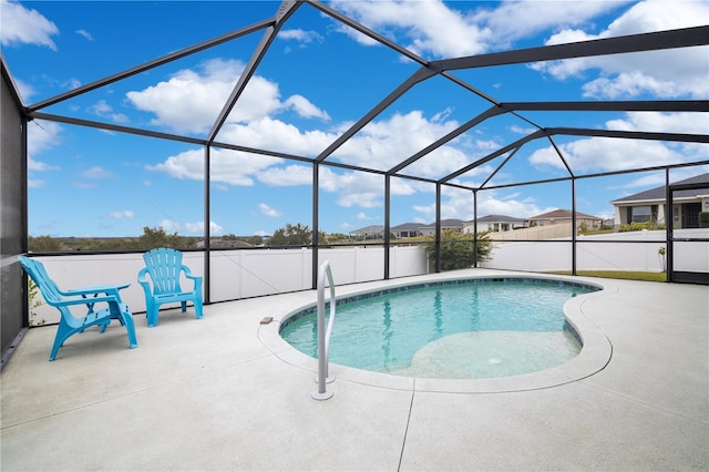 view of pool with a lanai and a patio