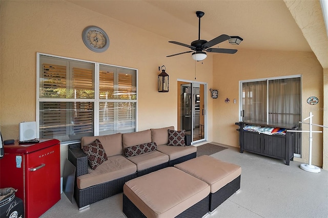 living room with lofted ceiling and ceiling fan