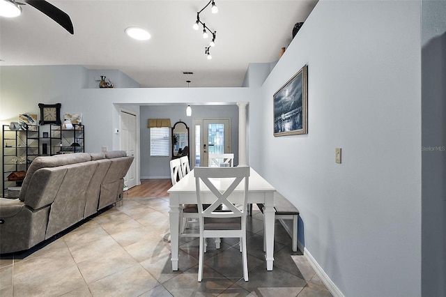 dining room featuring track lighting and light tile patterned floors