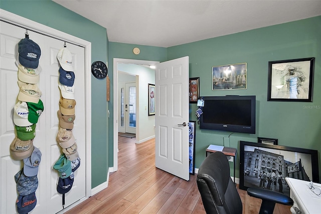 office space with light hardwood / wood-style floors