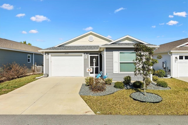 ranch-style home with a front yard and a garage