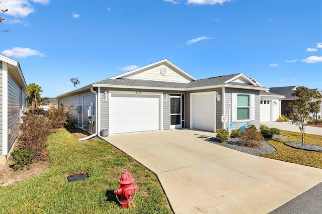 single story home with a front yard and a garage