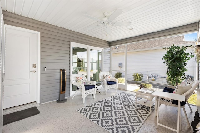 sunroom / solarium with ceiling fan